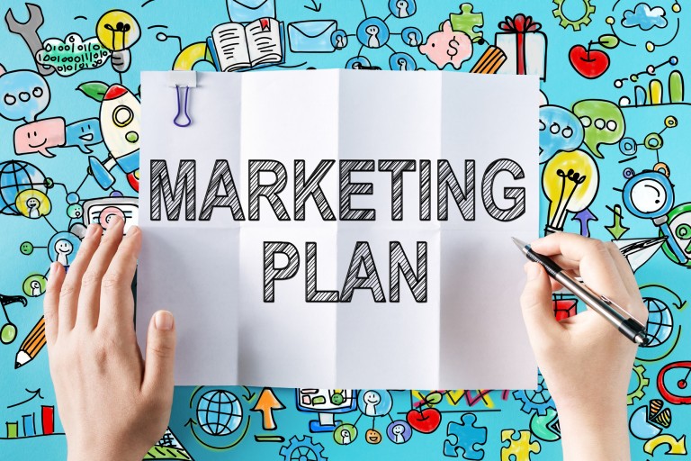 Marketing Plan text with hands